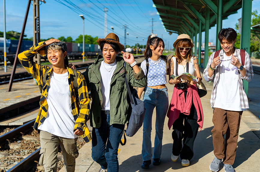 Group of diverse, young Filipino Gen Z individuals walking together outdoors in casual streetwear, representing the younger generation that has experienced rapid societal transformations.